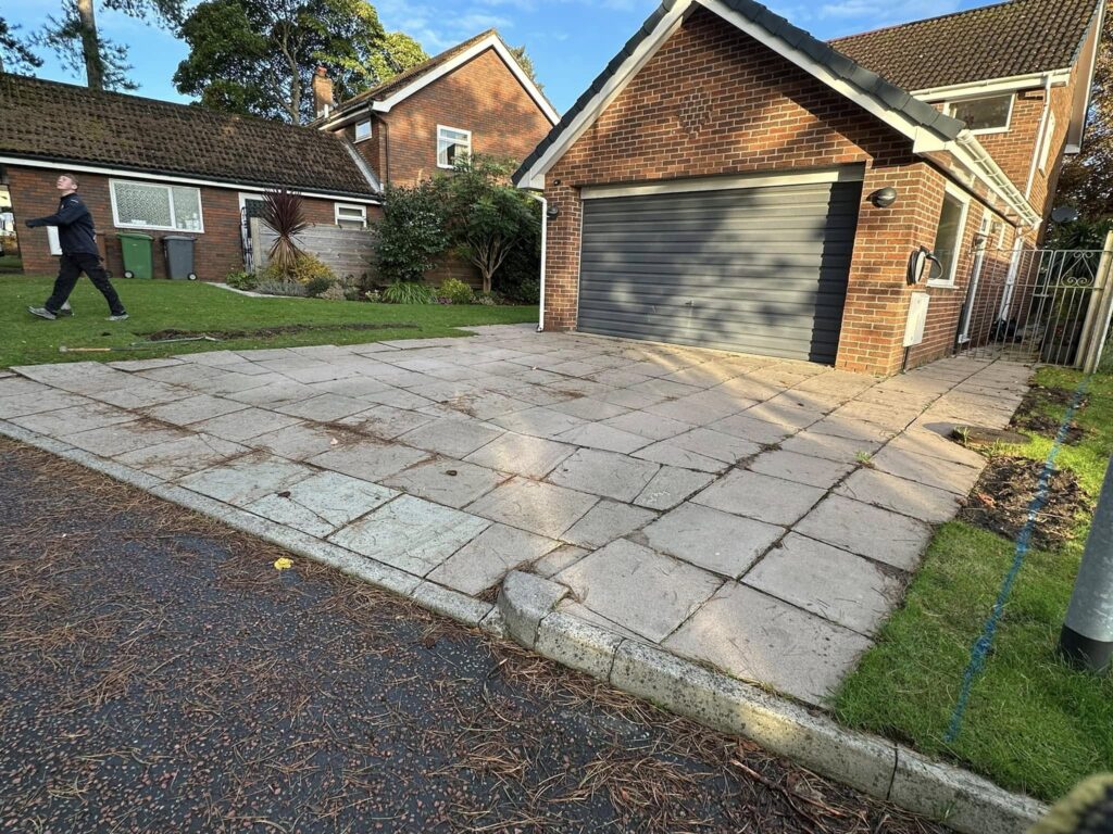 The old driveway was sloped up to the driveway leading to the garage, the customer needed this to be one level to make the most of the driveway area