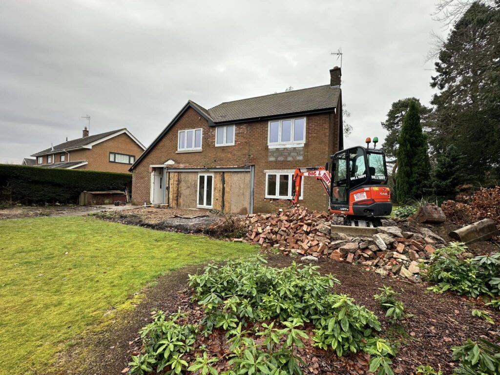 Dig and Shift clearing a site of bricks and creating a foundation for a new extention to the property being renovated in Christleton Cheshire